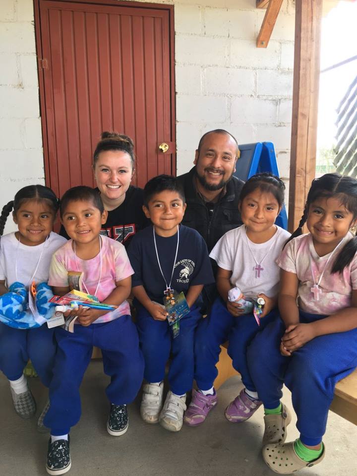 YSU Nursing student Ashley Milligan visits with residents of San Quintin, Mexico, on a previous mission trip. 